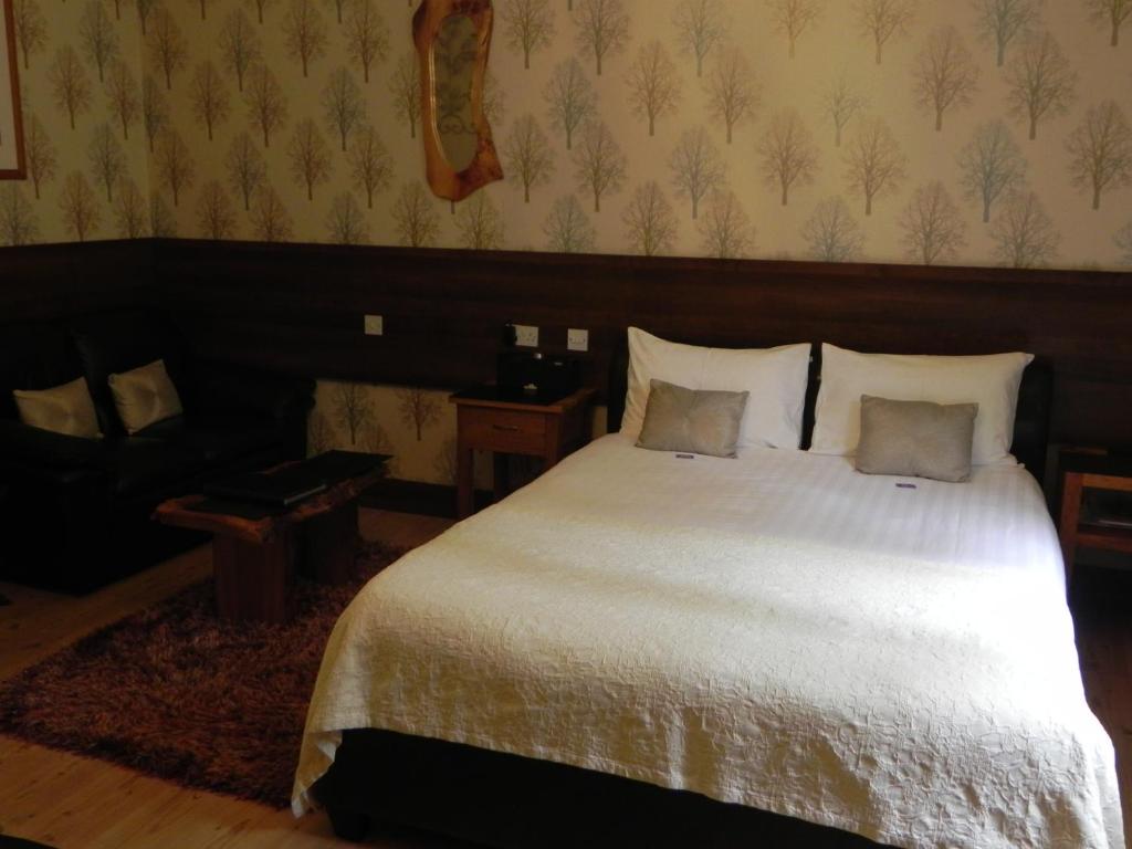 Postel nebo postele na pokoji v ubytování Pearse Lodge