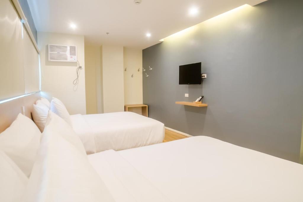 Postel nebo postele na pokoji v ubytování Bridge Hotel