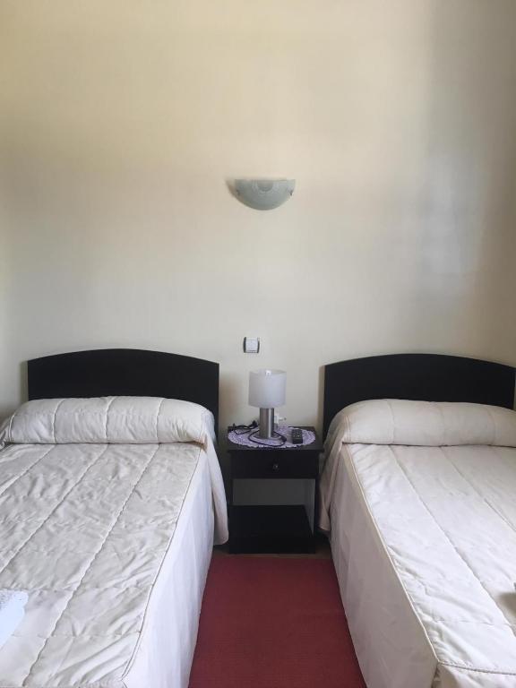 Postel nebo postele na pokoji v ubytování Maliana Star