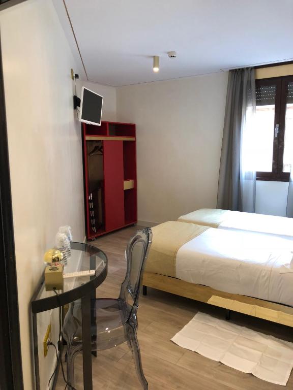 Postel nebo postele na pokoji v ubytování Grecorooms