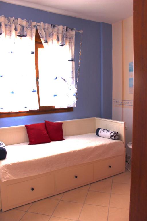 Postel nebo postele na pokoji v ubytování La casa allegra in rosso