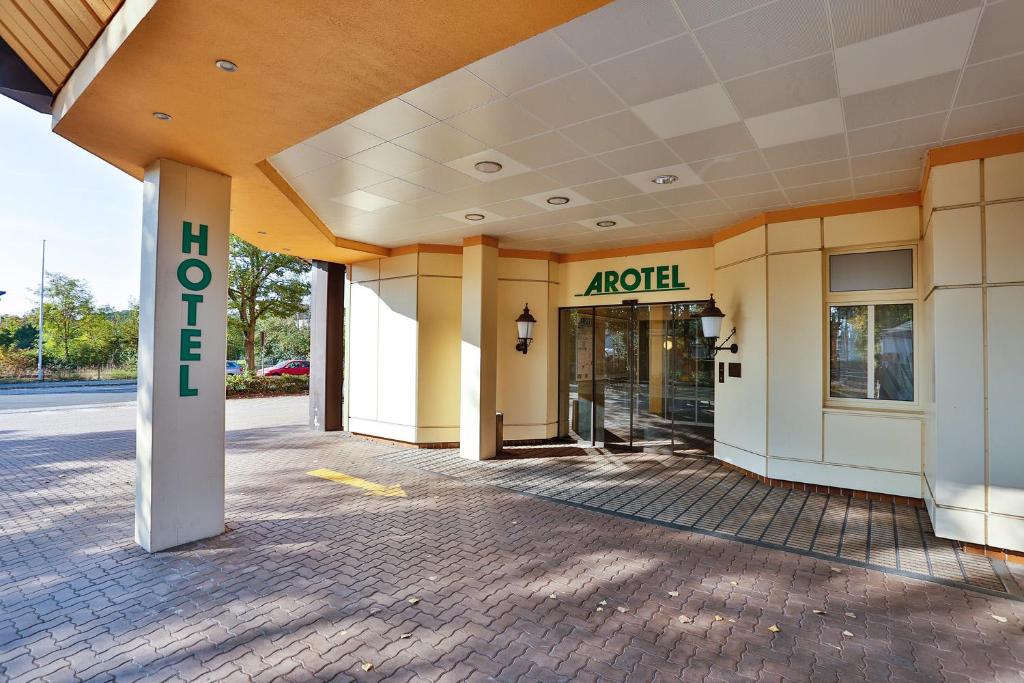 a building with a hotel sign on the side of it at Arotel Best living Nürnberg in Nürnberg