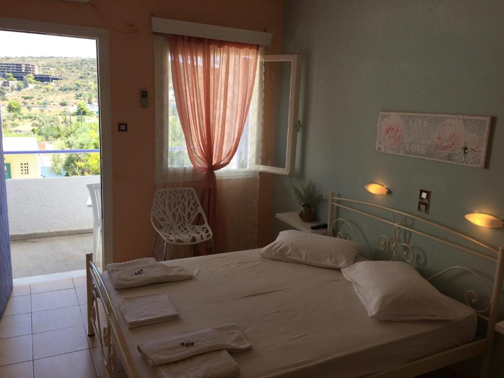 Postel nebo postele na pokoji v ubytování Isidora Hotel
