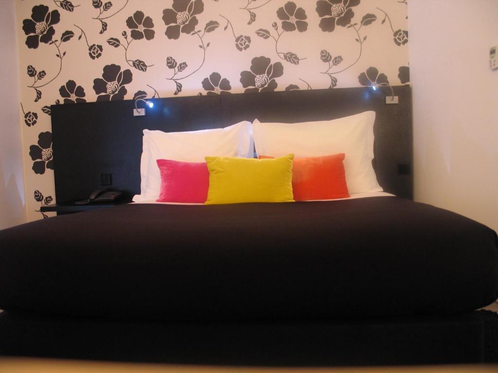 Postel nebo postele na pokoji v ubytování Funchal Design Hotel