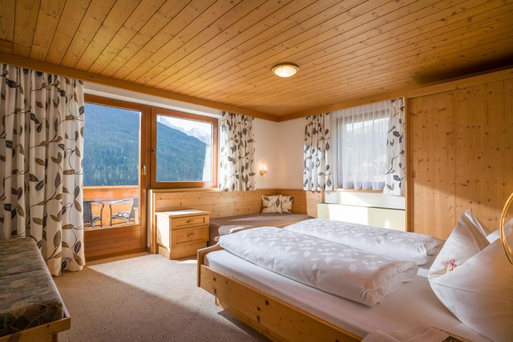 Postel nebo postele na pokoji v ubytování Grübelspitz
