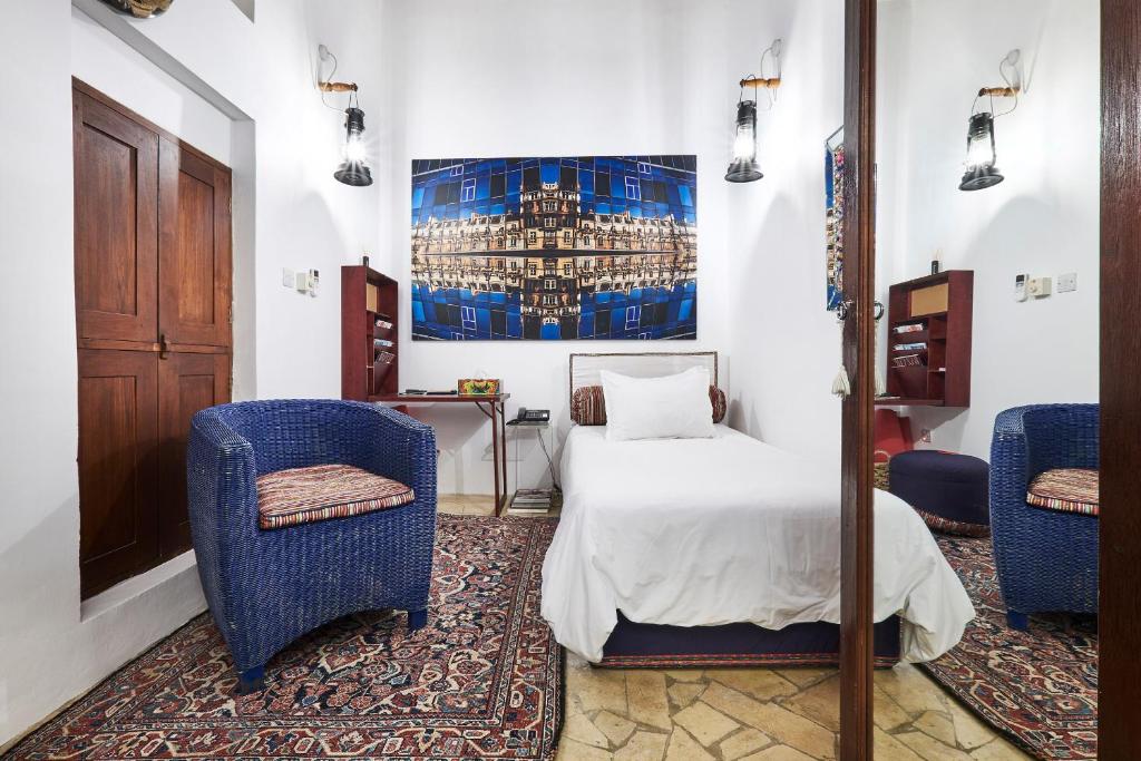 Ένα ή περισσότερα κρεβάτια σε δωμάτιο στο XVA Art Hotel