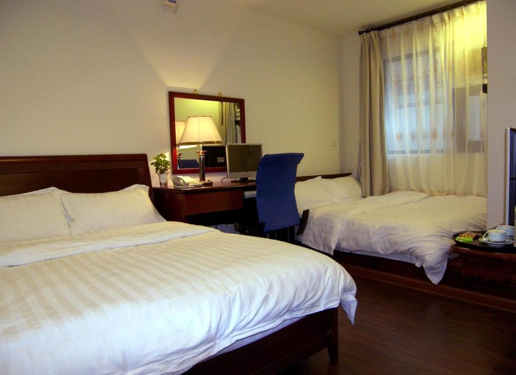 Postel nebo postele na pokoji v ubytování Dory Inn