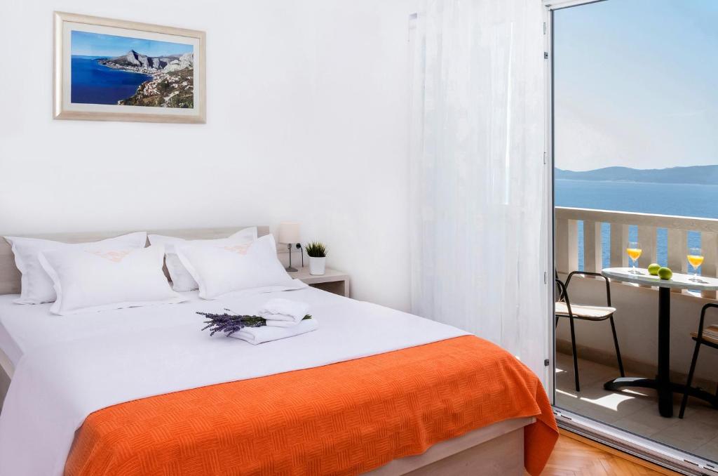 Postel nebo postele na pokoji v ubytování Apartmani Lučica