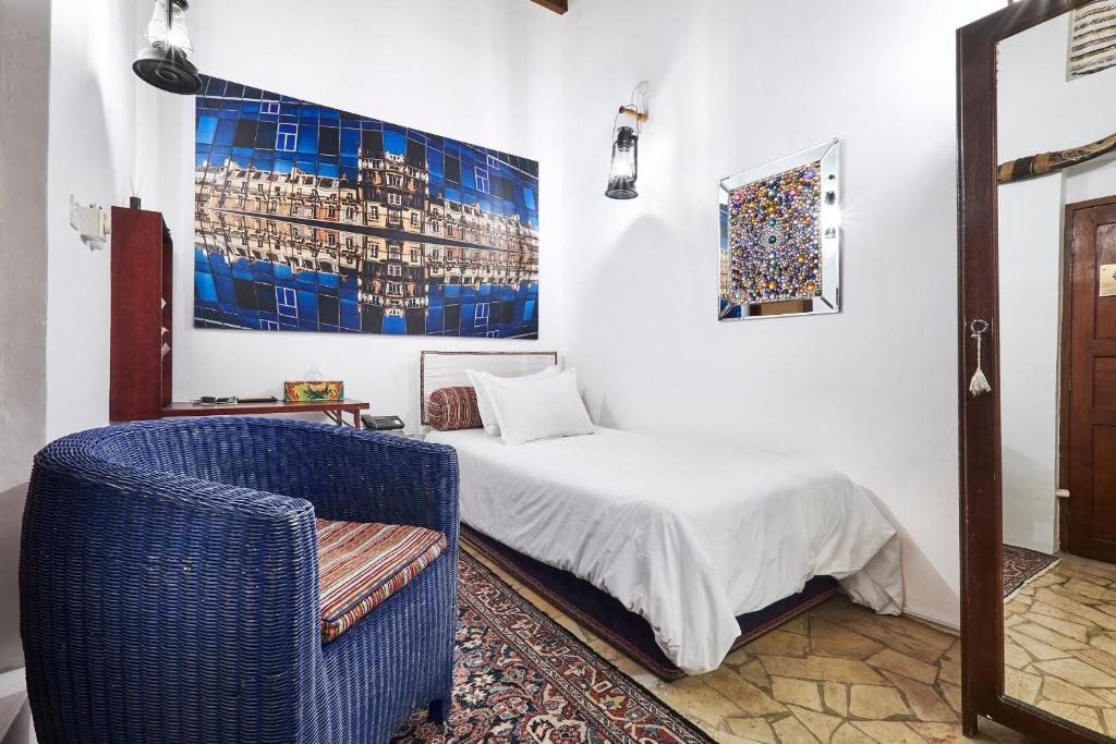 Ένα ή περισσότερα κρεβάτια σε δωμάτιο στο XVA Art Hotel