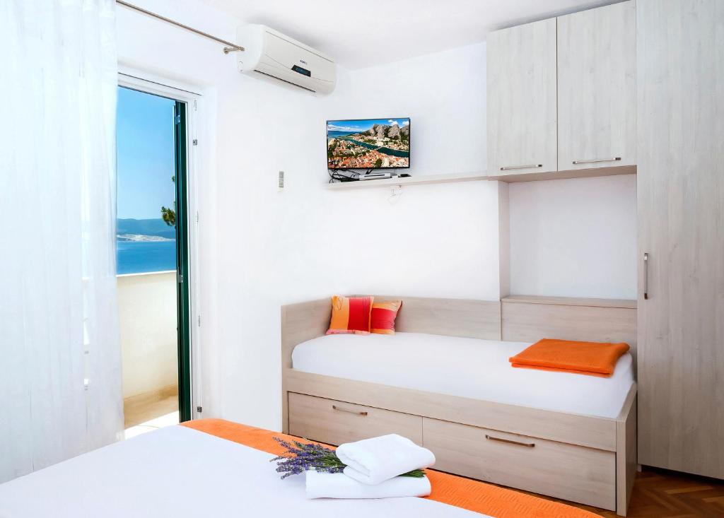 Postel nebo postele na pokoji v ubytování Apartmani Lučica