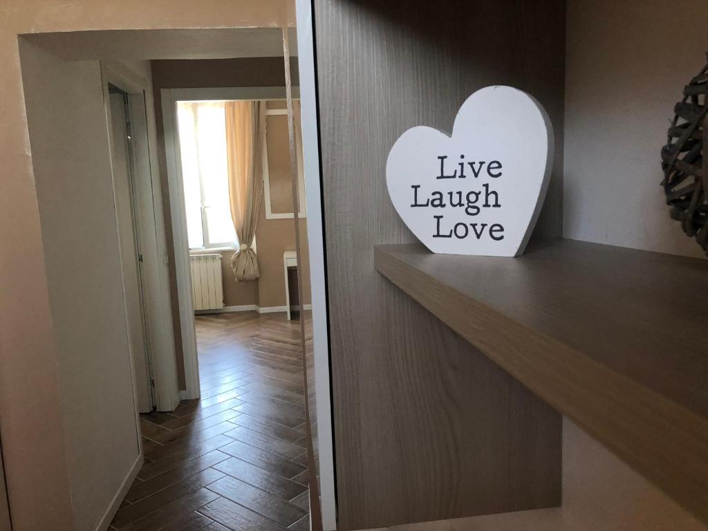 a sign on the door of a hotel room at Camaldoli House in Milan