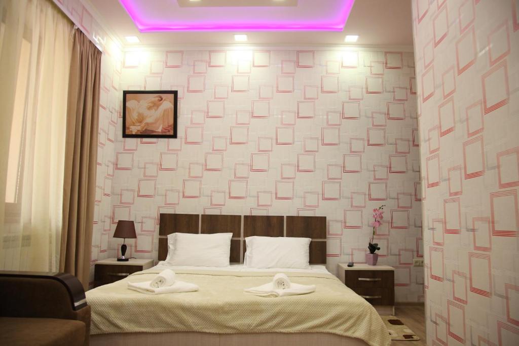 Postel nebo postele na pokoji v ubytování Hotel Felisa Gyumri