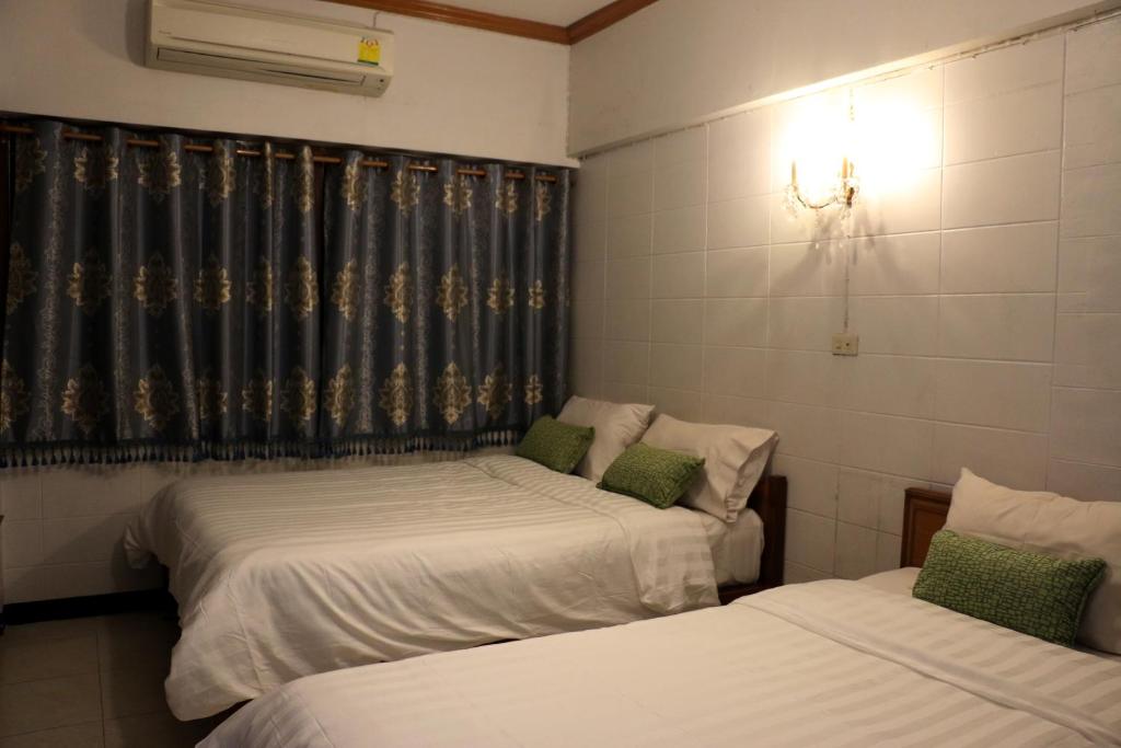 Postel nebo postele na pokoji v ubytování Nett Hotel