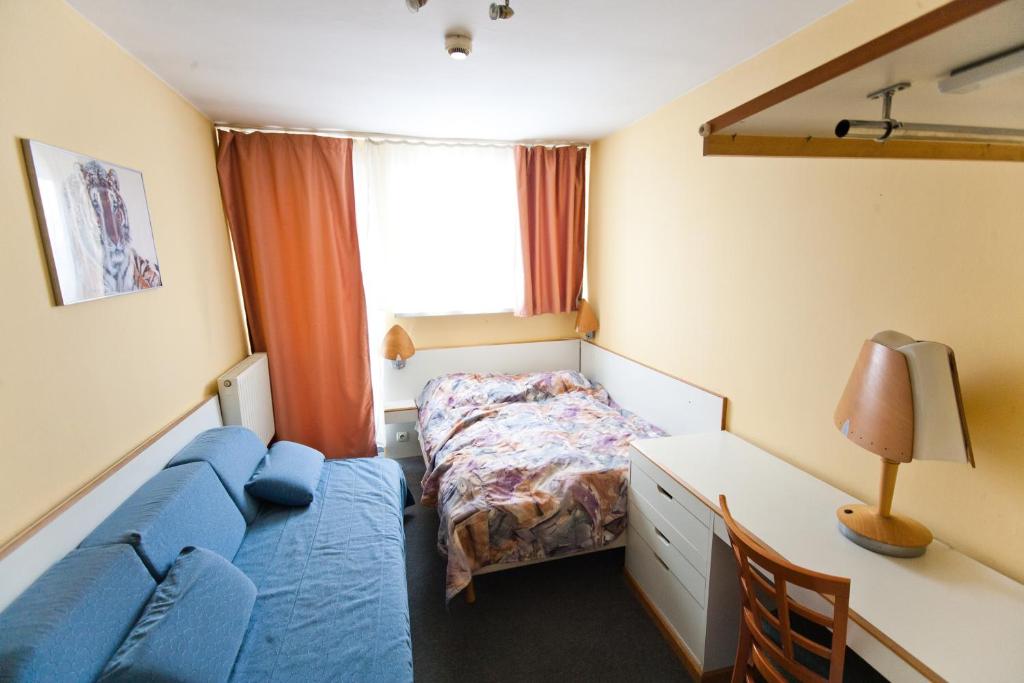 Posteľ alebo postele v izbe v ubytovaní Hostel Malinowski City