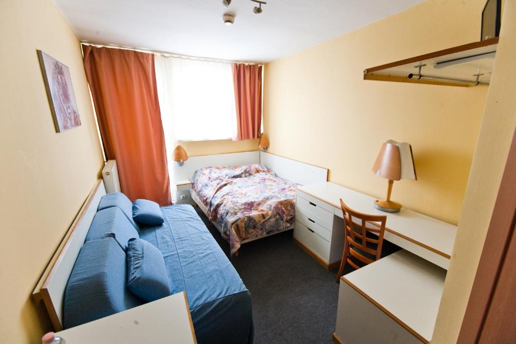 Posteľ alebo postele v izbe v ubytovaní Hostel Malinowski City