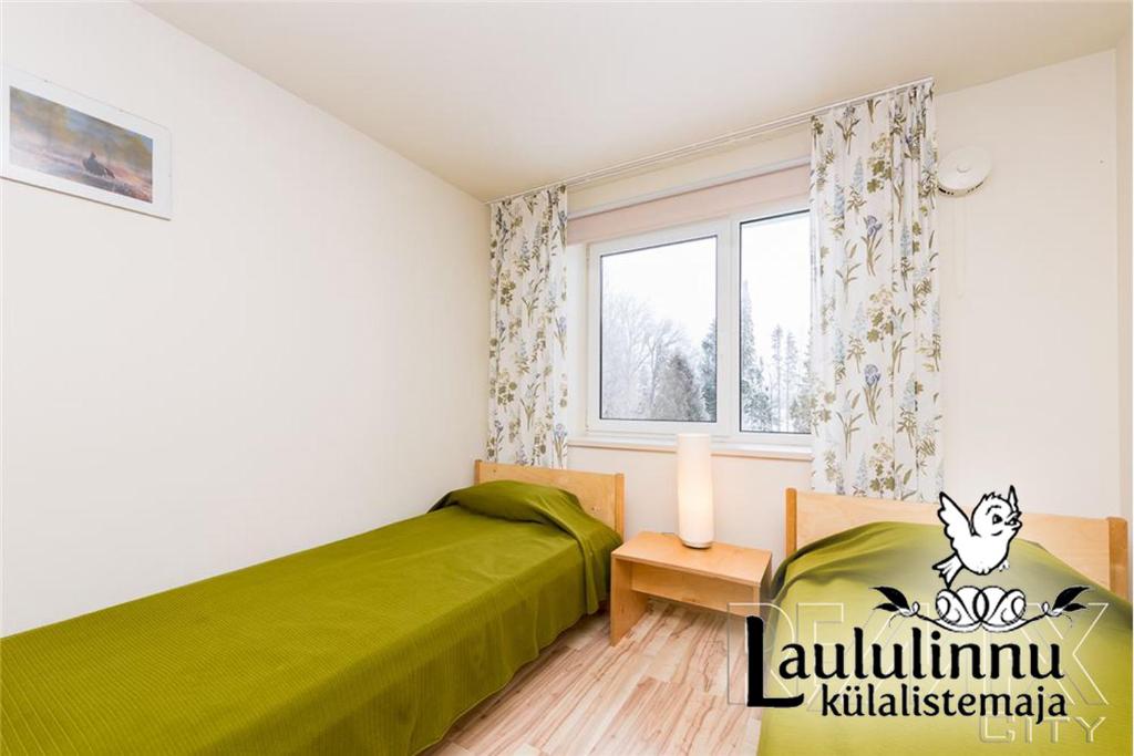Postel nebo postele na pokoji v ubytování Laululinnu Guesthouse