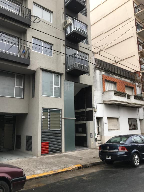 a black car parked in front of a building at Dpto. en Palermo Hollywood in Buenos Aires