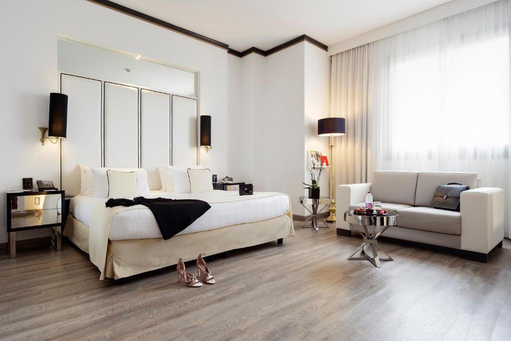 Кровать или кровати в номере Meliá Milano