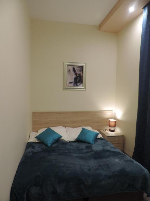 Łóżko lub łóżka w pokoju w obiekcie Apartament Blue