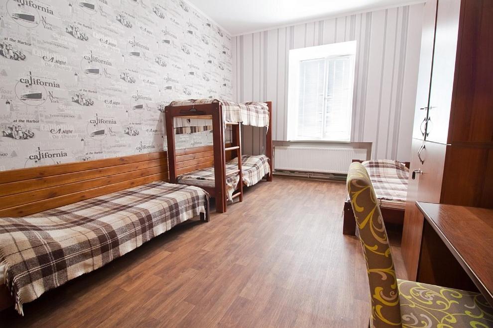 Postel nebo postele na pokoji v ubytování Tsentr Hostel