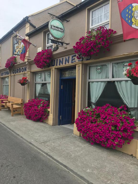 a store with flowers on the front of a building at Gordon's Guesthouse in Loughrea