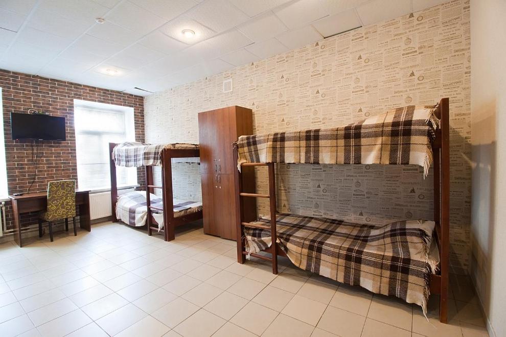 Postel nebo postele na pokoji v ubytování Tsentr Hostel