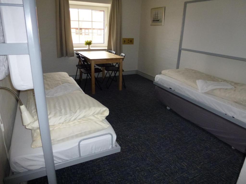 Postel nebo postele na pokoji v ubytování Danhostel Frederikshavn City