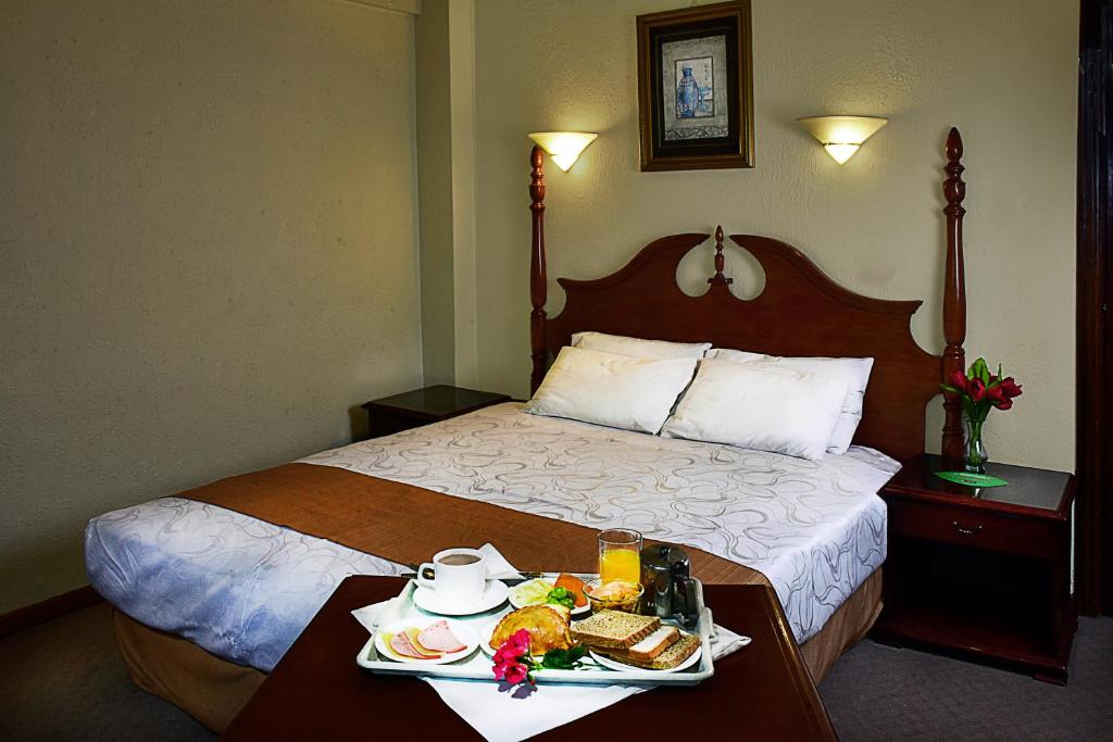 Cama o camas de una habitación en Alcalá Apart Hotel
