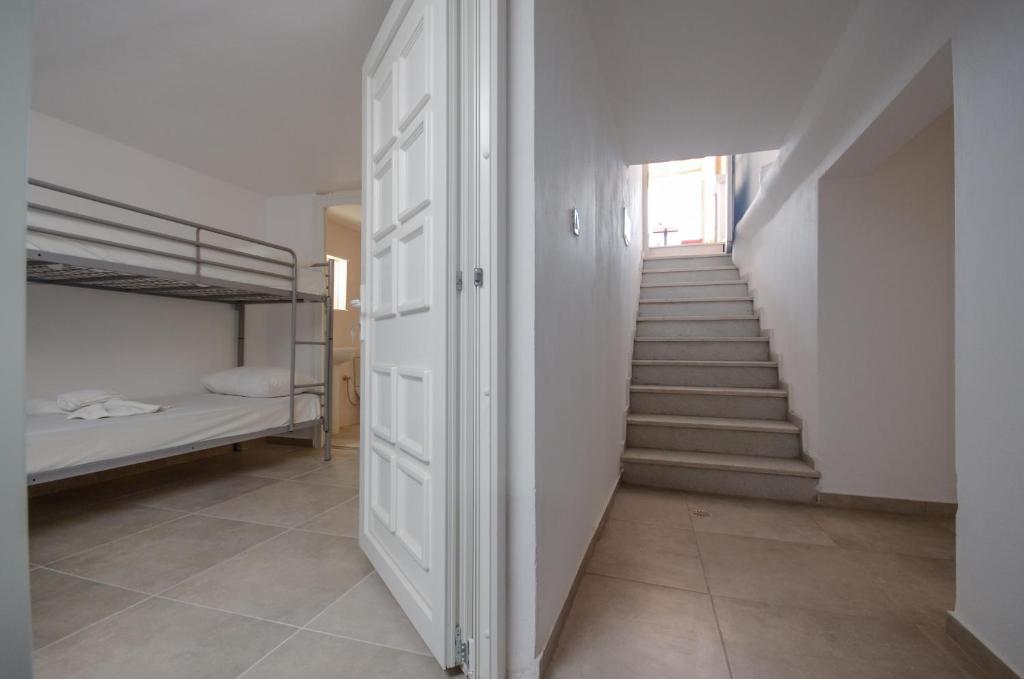 Postel nebo postele na pokoji v ubytování Naxos Hostel