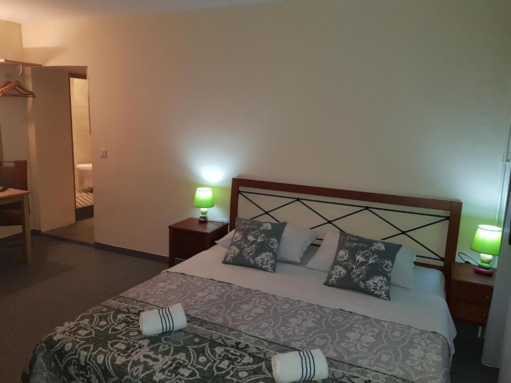 Postel nebo postele na pokoji v ubytování ELG Rooms