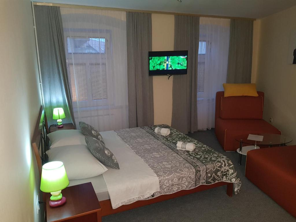 Postel nebo postele na pokoji v ubytování ELG Rooms