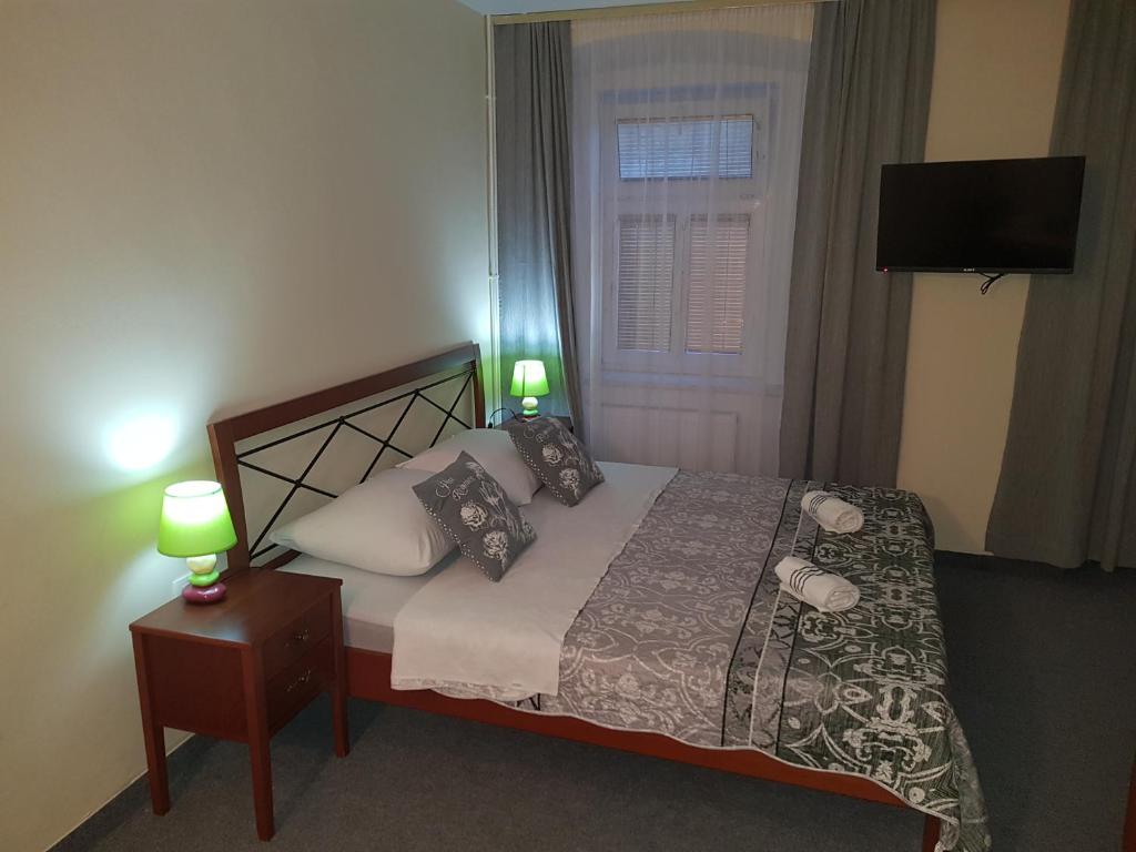 Postel nebo postele na pokoji v ubytování ELG Rooms