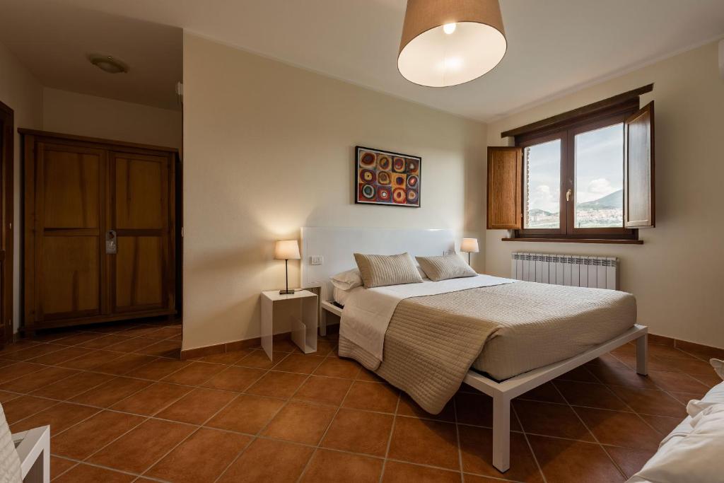 Postel nebo postele na pokoji v ubytování Assisium Agriturismo