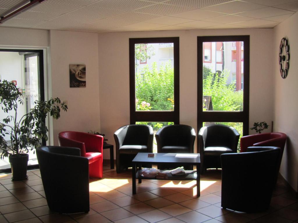 Posezení v ubytování Hôtel Le Saint Joseph