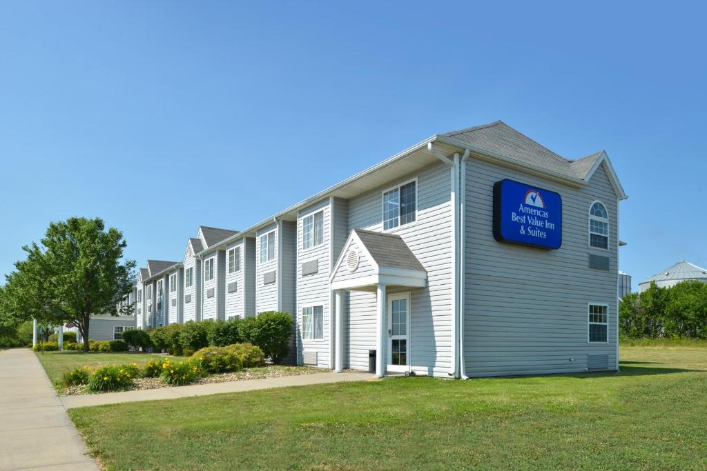 a large white building with a blue sign on it at Americas Best Value Inn & Suites Maryville in Maryville