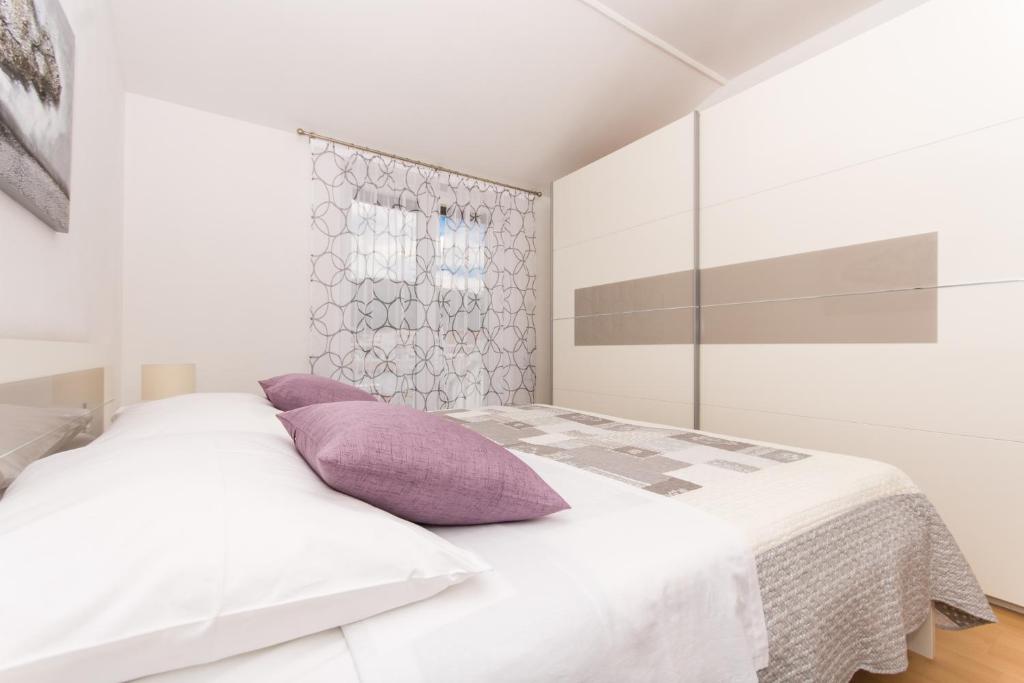Posteľ alebo postele v izbe v ubytovaní Apartments Barba