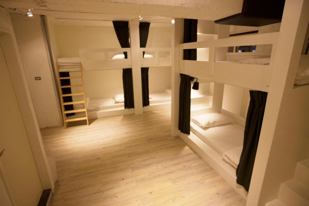 a view of a room with bunk beds at Mr. Lobster’s Secret Den design hostel in Taipei