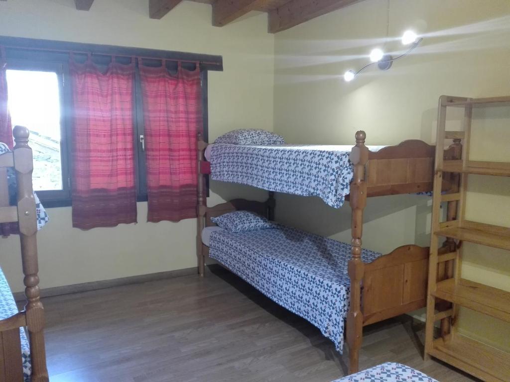 Postel nebo postele na pokoji v ubytování Refugi Casa Canelo