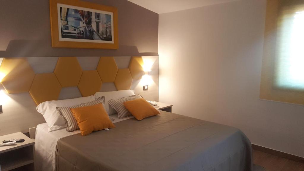 Postel nebo postele na pokoji v ubytování B&B Il Campanile
