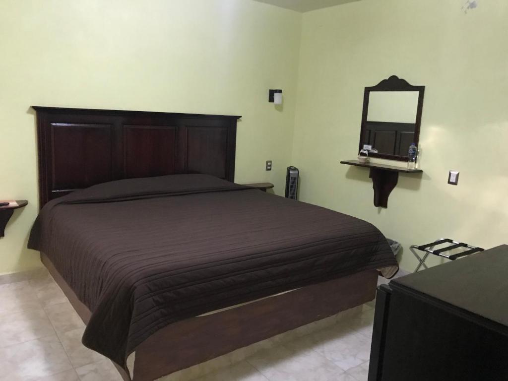Postel nebo postele na pokoji v ubytování Hotel El Refugio