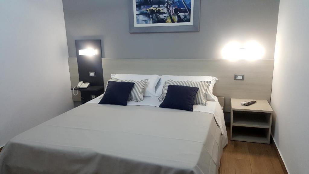 Postel nebo postele na pokoji v ubytování B&B Il Campanile