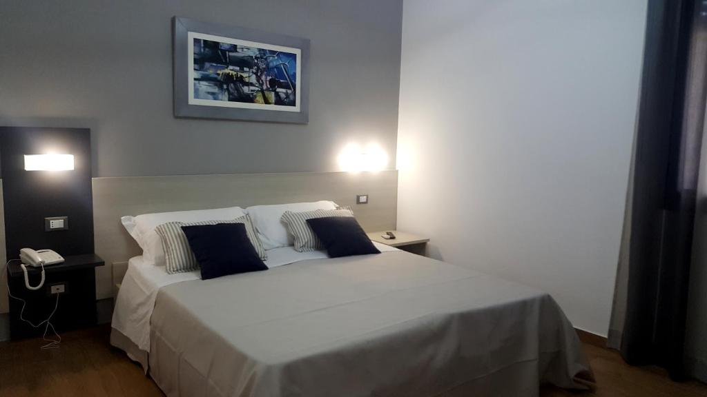 Postel nebo postele na pokoji v ubytování B&B Il Campanile
