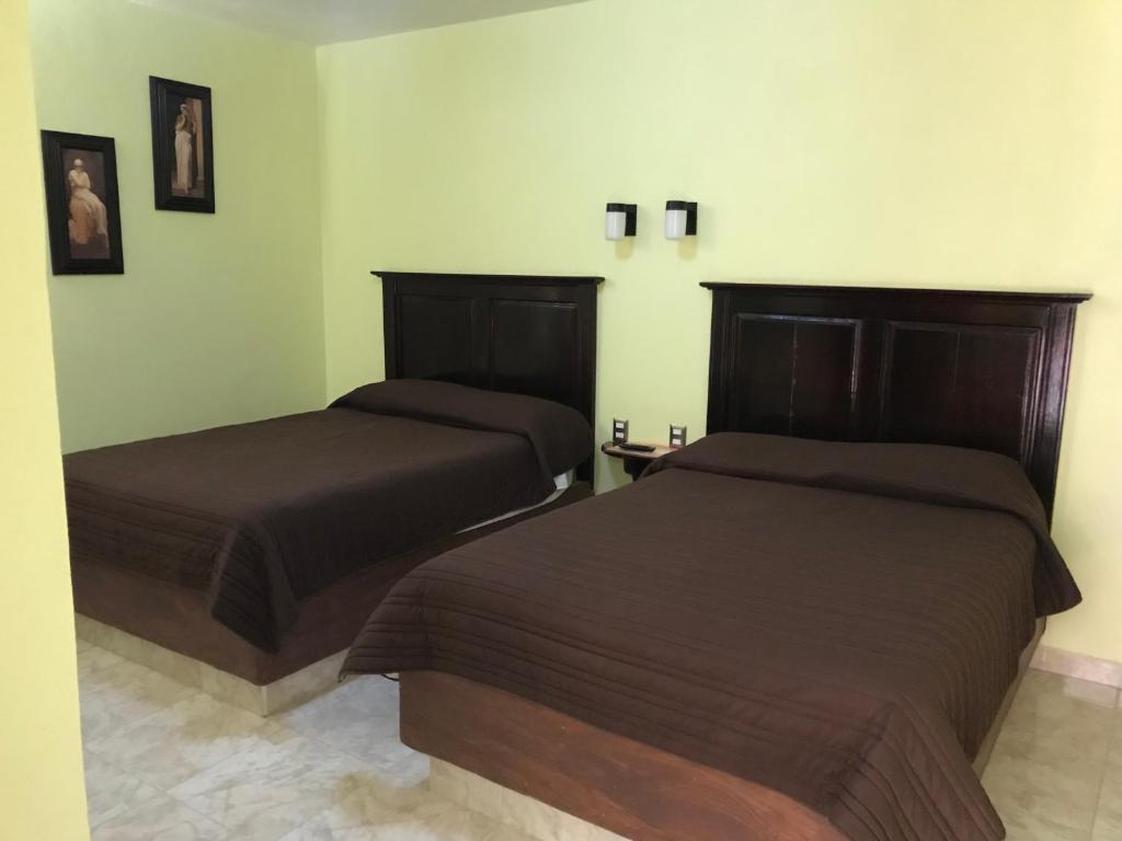 Postel nebo postele na pokoji v ubytování Hotel El Refugio