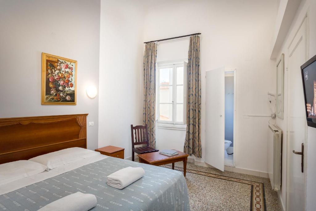 A bed or beds in a room at CASA MICOL - Centro Ƒirenze