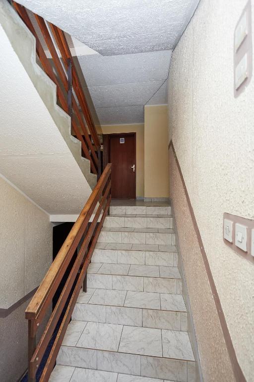 a hallway with a staircase in a building at Apartmani Malica in Soko Banja