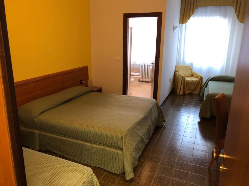 Postel nebo postele na pokoji v ubytování Hotel Centrale
