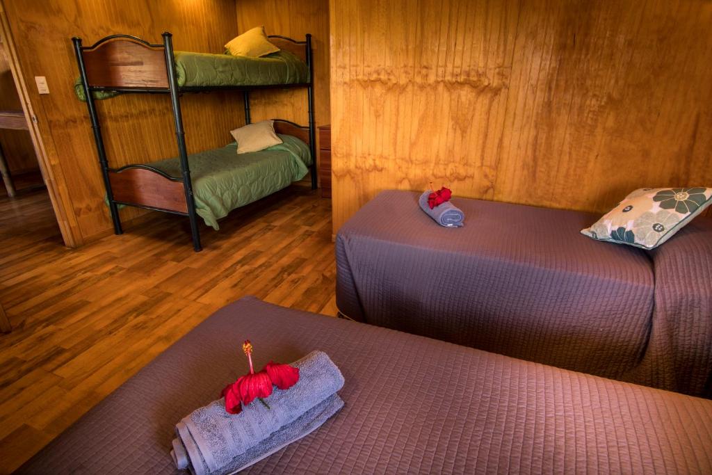Postel nebo postele na pokoji v ubytování Cabañas Tokerau