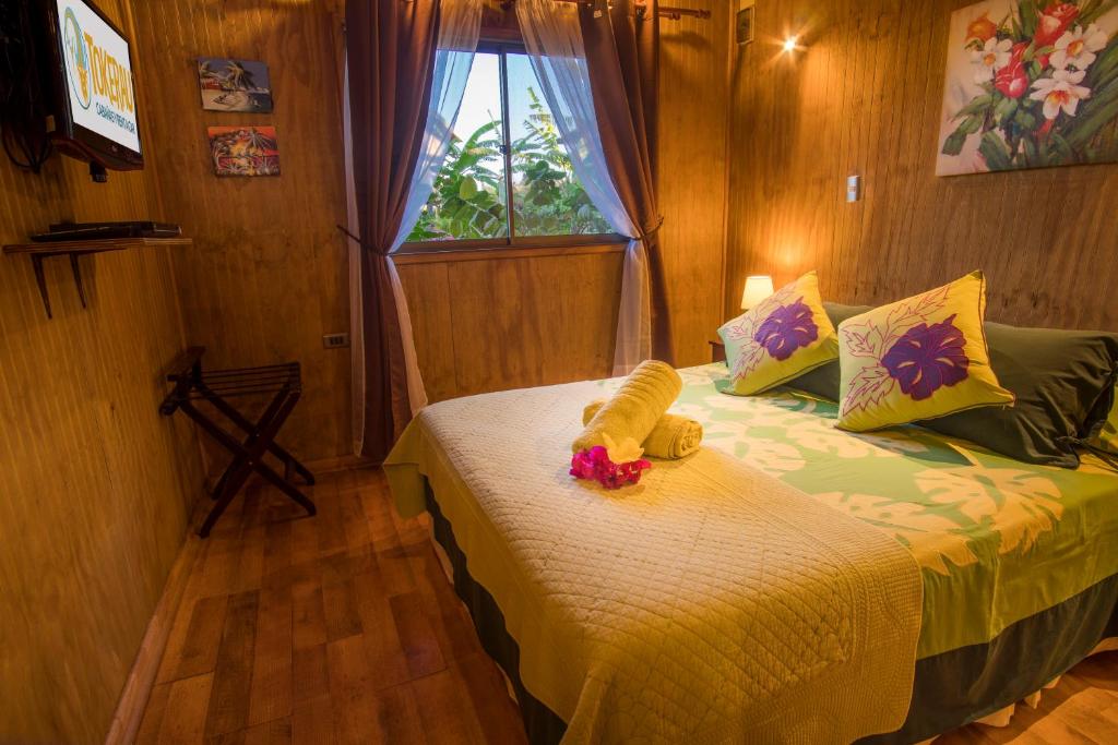 Postel nebo postele na pokoji v ubytování Cabañas Tokerau