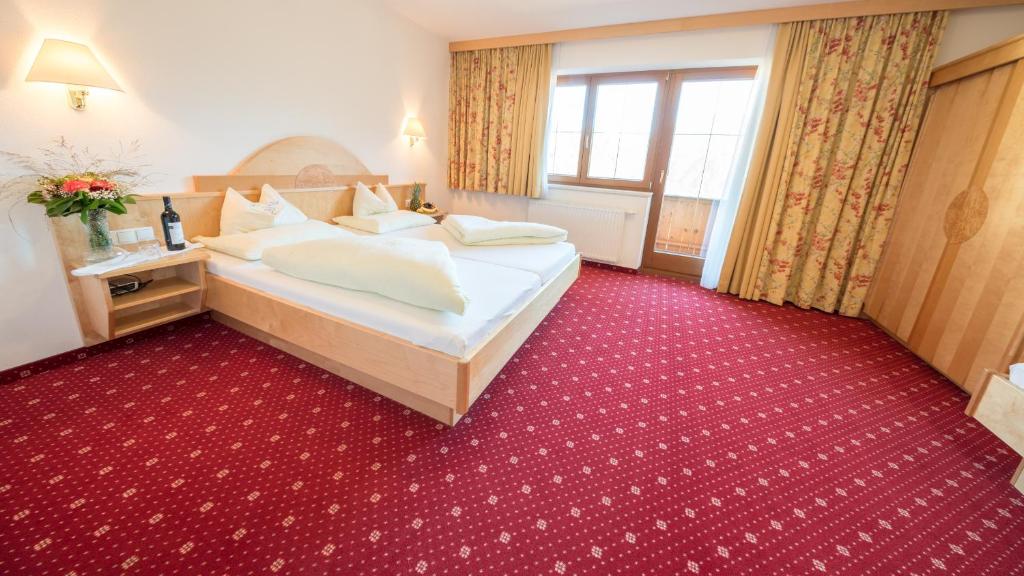 Postel nebo postele na pokoji v ubytování Superior Hotel Persal