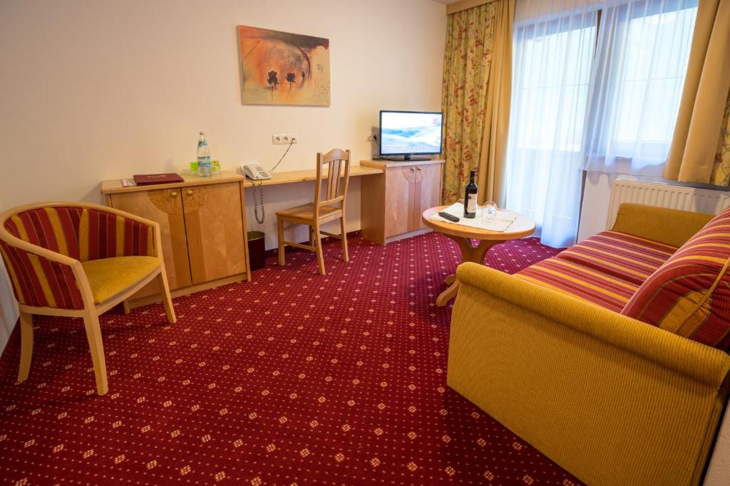 TV a/nebo společenská místnost v ubytování Superior Hotel Persal